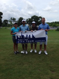 Golfers holding Houston 2015 City banner